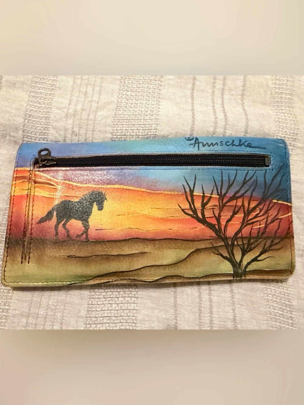 Anuschka hand-painted leather wallet featuring a vibrant 